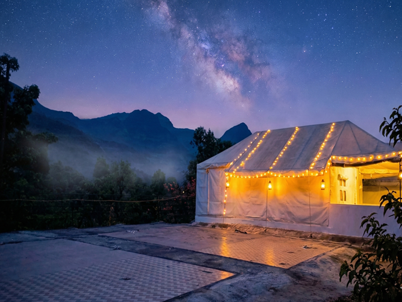 Beautiful night camping tent surrounded by mountains and stars at the Best Resort in Bhandardara