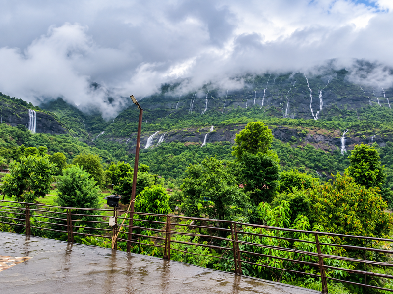 Travellers enjoying Arthur Lake during a stay at the Best Resort in Bhandardara