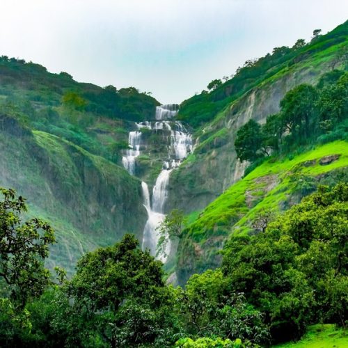 Scenic hill view from Necklace Hill View Resort in Bhandardara surrounded by lush green mountains and natural landscapes, offering a peaceful getaway for nature lovers.