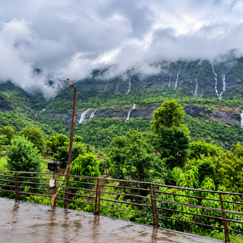 Travellers enjoying Arthur Lake during a stay at the Best Resort in Bhandardara