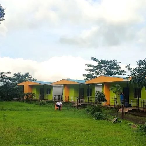 Solo traveller enjoying mountain views near the Best Resort in Bhandardara