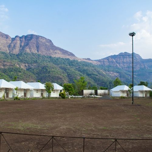 Misty morning over the hills and lake in Bhandardara